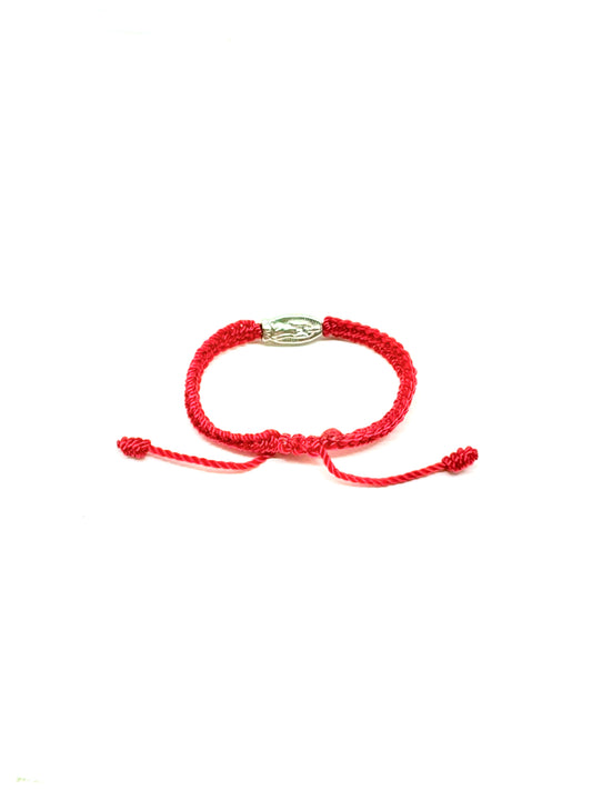 Back view of adjustable red braided baby bracelet with silver Our Lady of Guadalupe charm and silver beads, fits infants 0–12 months on a white background