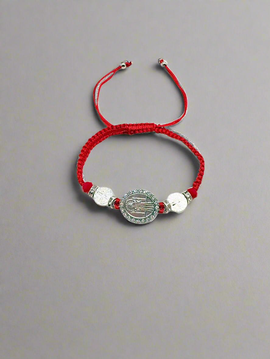 Red Threaded St. Benedict Silver medal Bracelet Adjustable with silver beads on a grya background