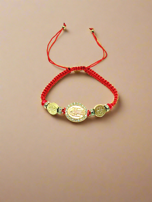 Red Threaded St. Benedict Gold Medal Bracelet Adjustable with silver beads on a gold background