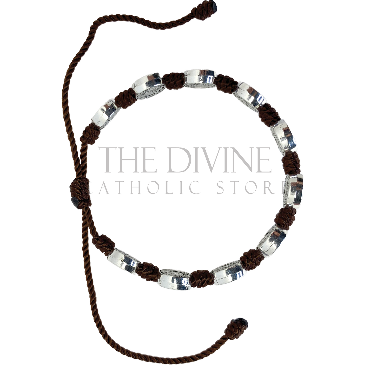 Top view of a St. Benedict 10 Medal brown cord bracelet with oxidized silver accents, adjustable size on a white background.
