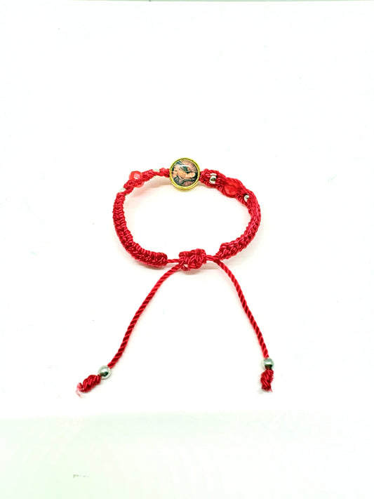 Back view of Red woven baby bracelet with Our Lady of Guadalupe charm, silver beads, and adjustable cord for infants aged 0–12 months on a white background white background