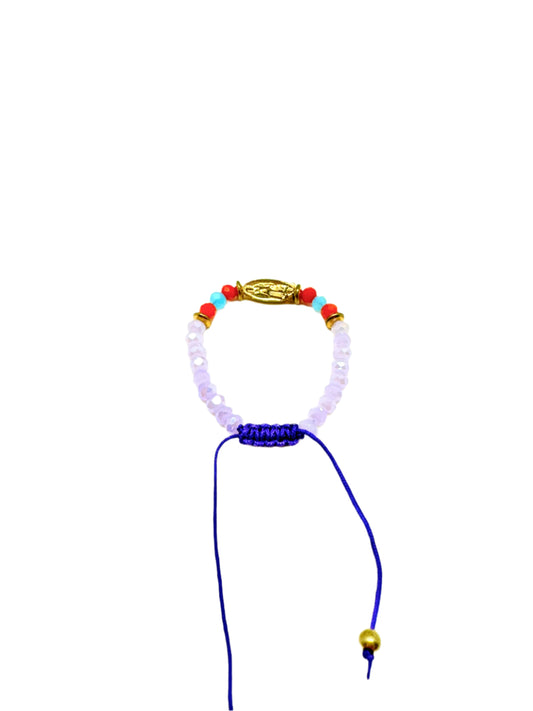 Back view of a purple beaded gold colored Guadalupe charm baby, accented with red and blue beads bracelet on a white background.
