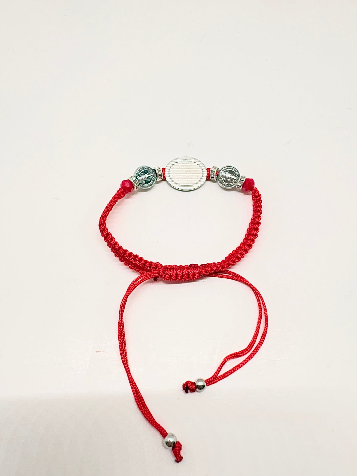 Back view of red Threaded St. Benedict Silver Medal Bracelet Adjustable with silver beads on a white background