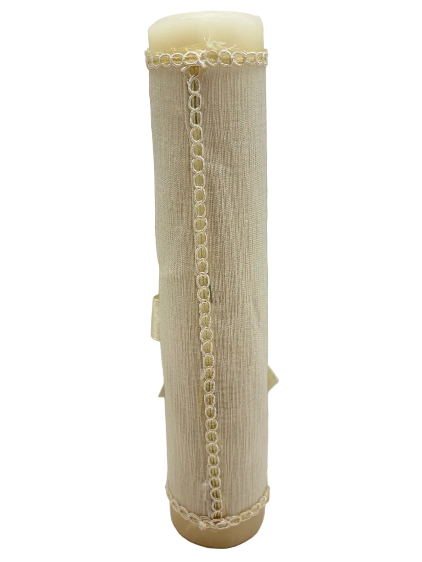Side view of beige fabric wrapped baptism candle with trim detail