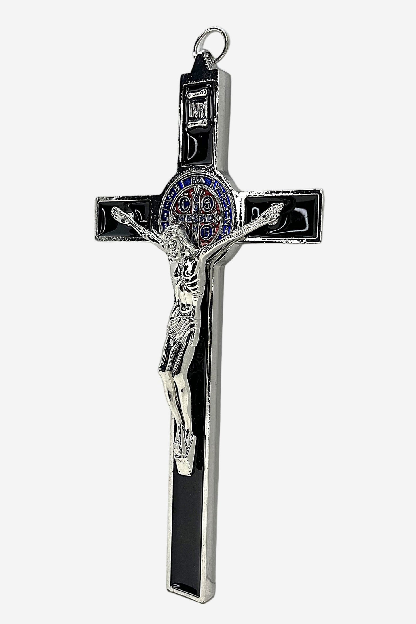Side view of St. Benedict Crucifix with Black Enamel, blue, red and silver St. Benedict medal, silver corpus Cristi on white background.