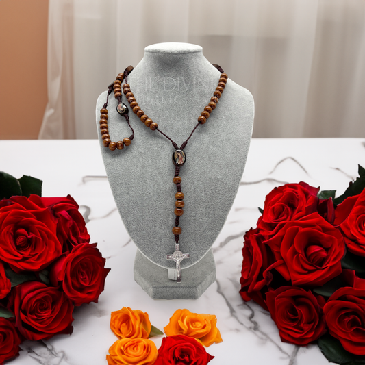 Our Lady of Guadalupe wooden rosary displayed on gray jewelry bust, 17-inch Catholic prayer beads with St. Benedict crucifix.