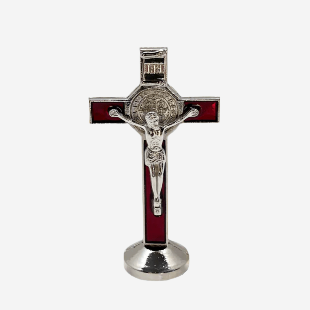 Front view of red St. Benedict car cross 3 inches tall, with adhesive sticker on the bottom, has silver corpus cristi and St. Benedict medal on a white background.