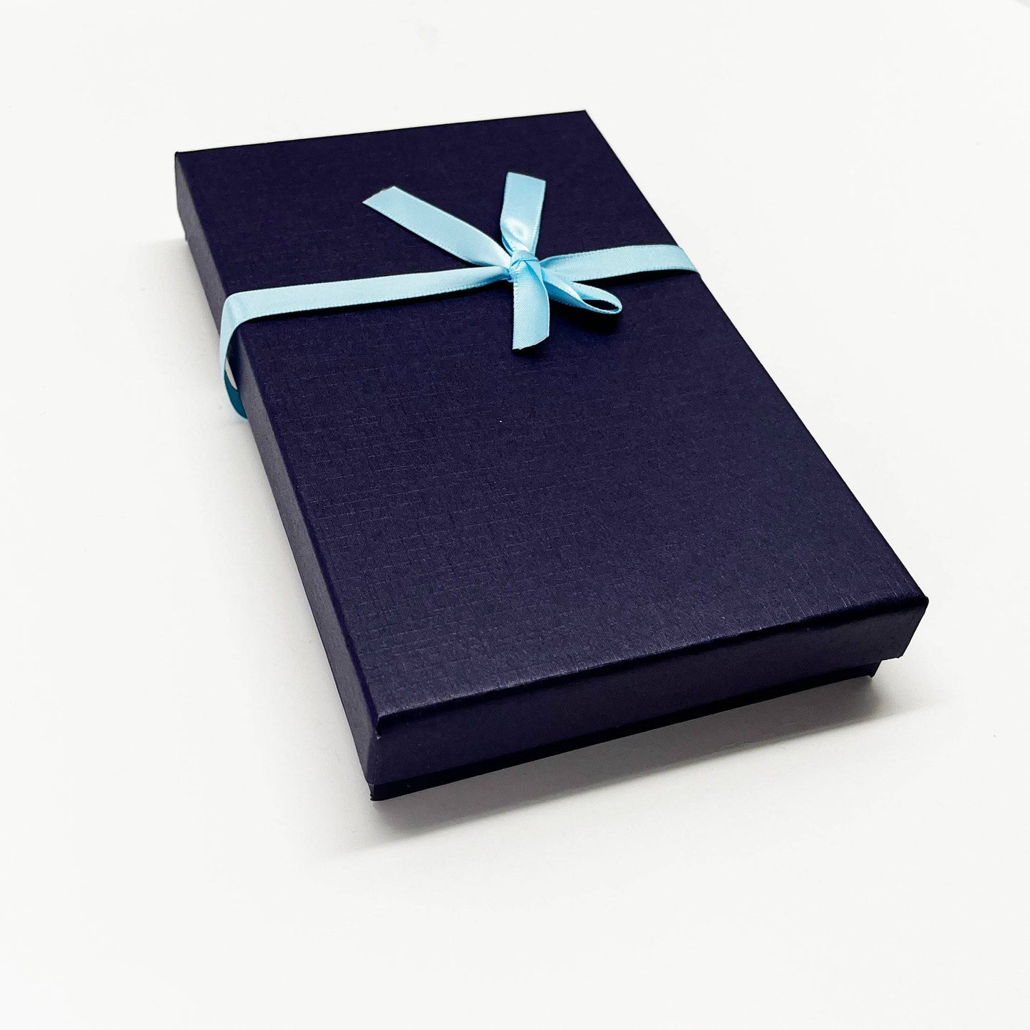 7-inch red St. Benedict crucifix with silver corpus, medal, and wood inlay, displayed with gift box