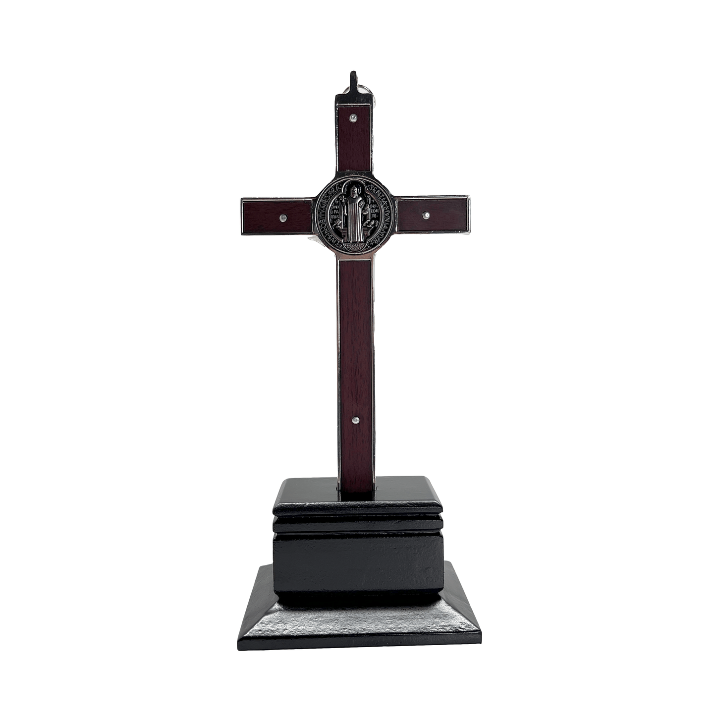 Back view of a 9 inch St. Benedict crucifix with a silver plated design and a wooden base, with a loop for hanging.