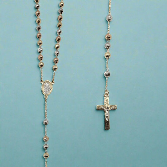 18k tri-color gold plated rosary with Our Lady of Guadalupe pendant and crucifix on a blue background.