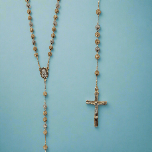 18k tri-color gold plated rosary with Our Lady of Guadalupe pendant and crucifix on a blue background.