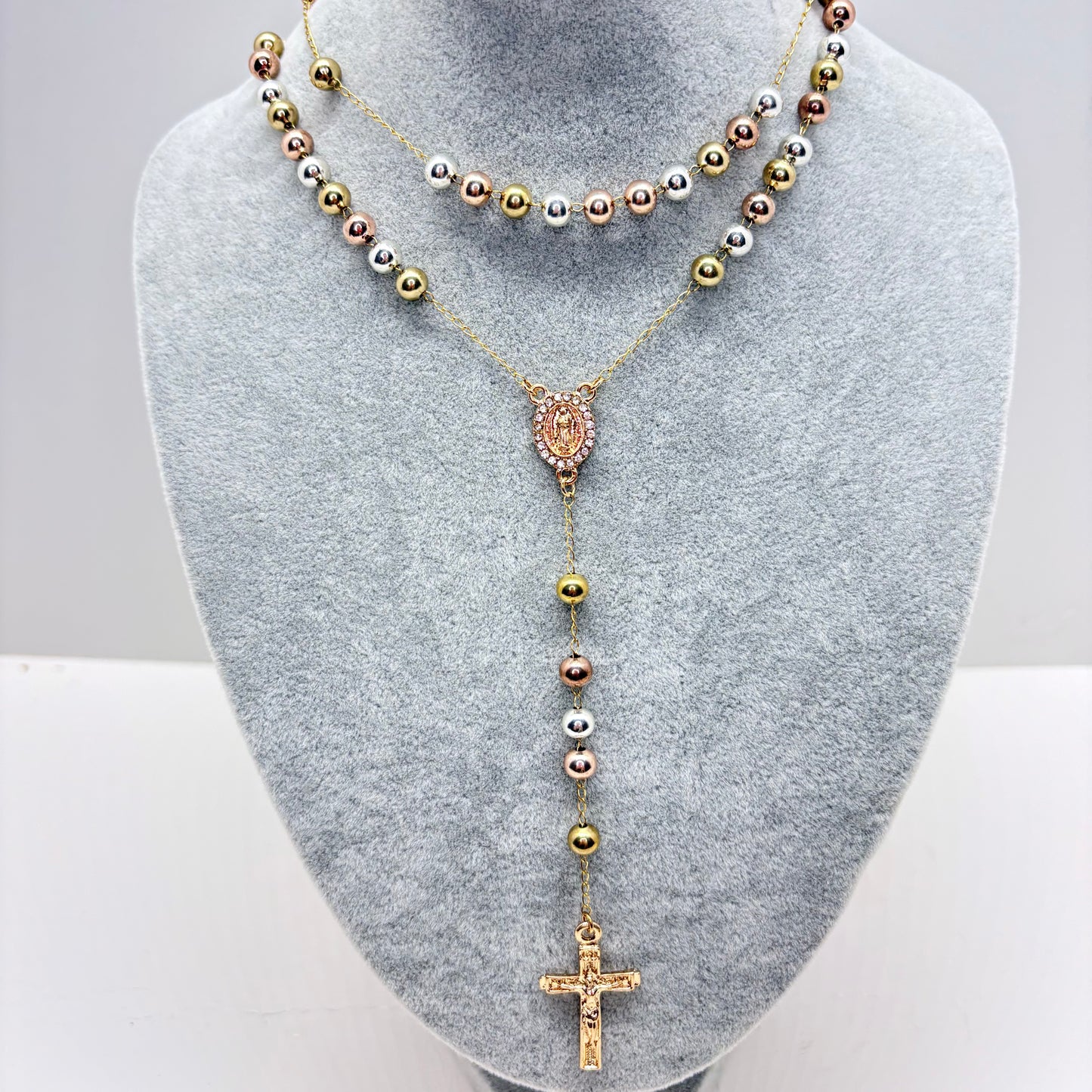 Tri-color Guadalupe rosary necklace with smooth beads and CZ pendant on gray display stand 18 inch Catholic jewelry