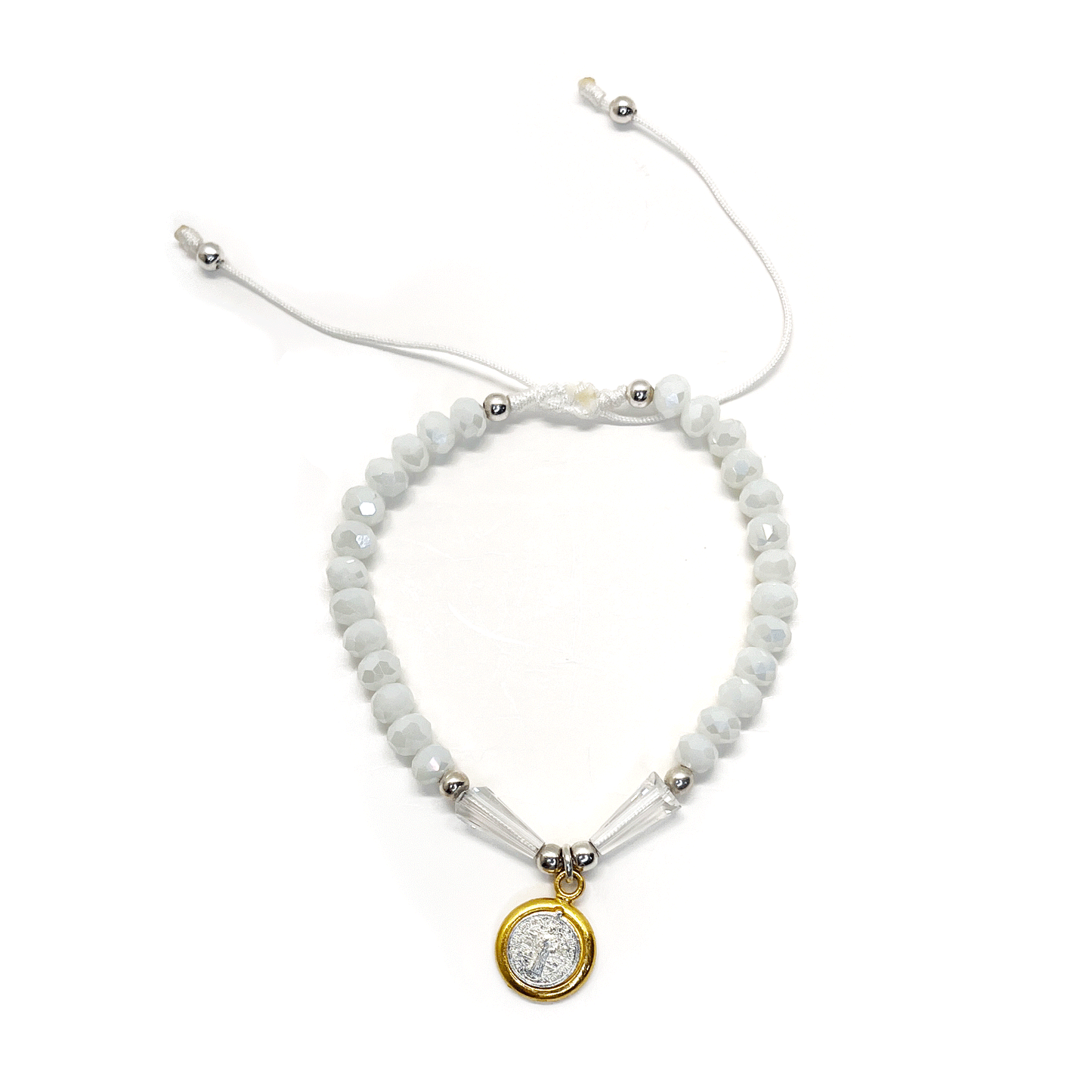 Front view of a adjustable white St. Benedict bracelet featuring durable nylon thread, silver accents, and rhinestone beads on a white background. 