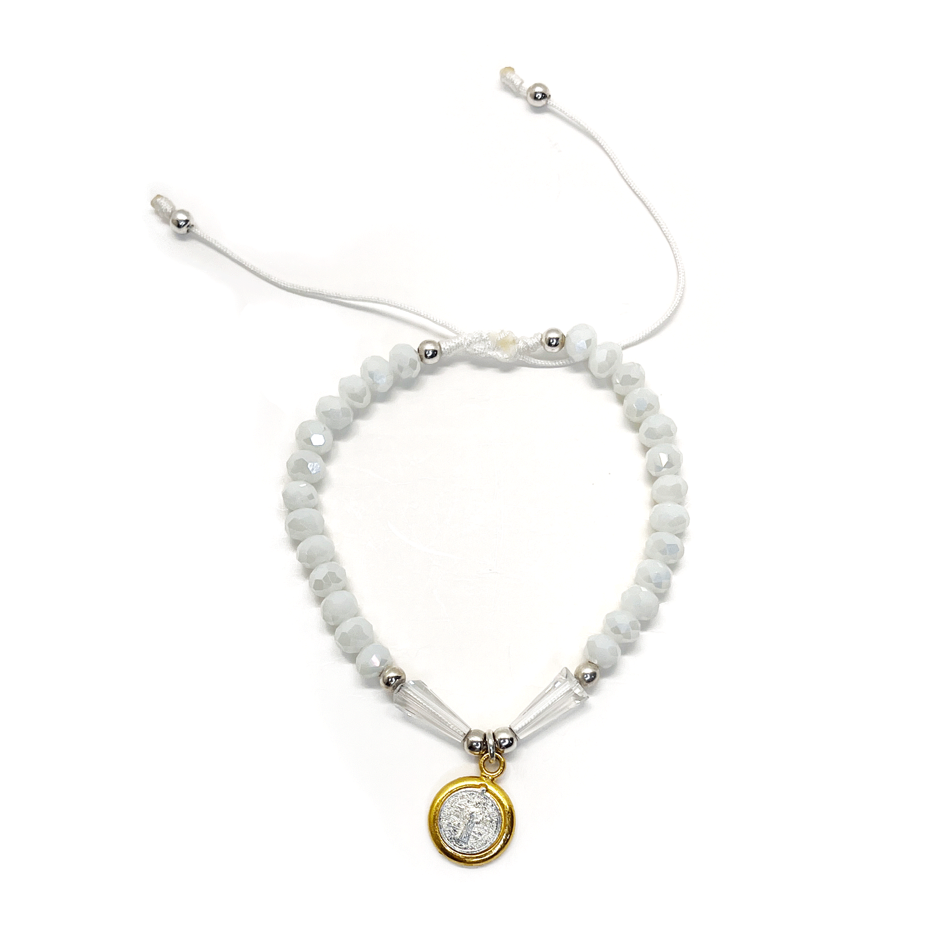 Front view of a adjustable white St. Benedict bracelet featuring durable nylon thread, silver accents, and rhinestone beads on a white background. 