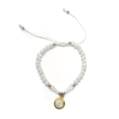 Front view of a adjustable white St. Benedict bracelet featuring durable nylon thread, silver accents, and rhinestone beads on a white background. 