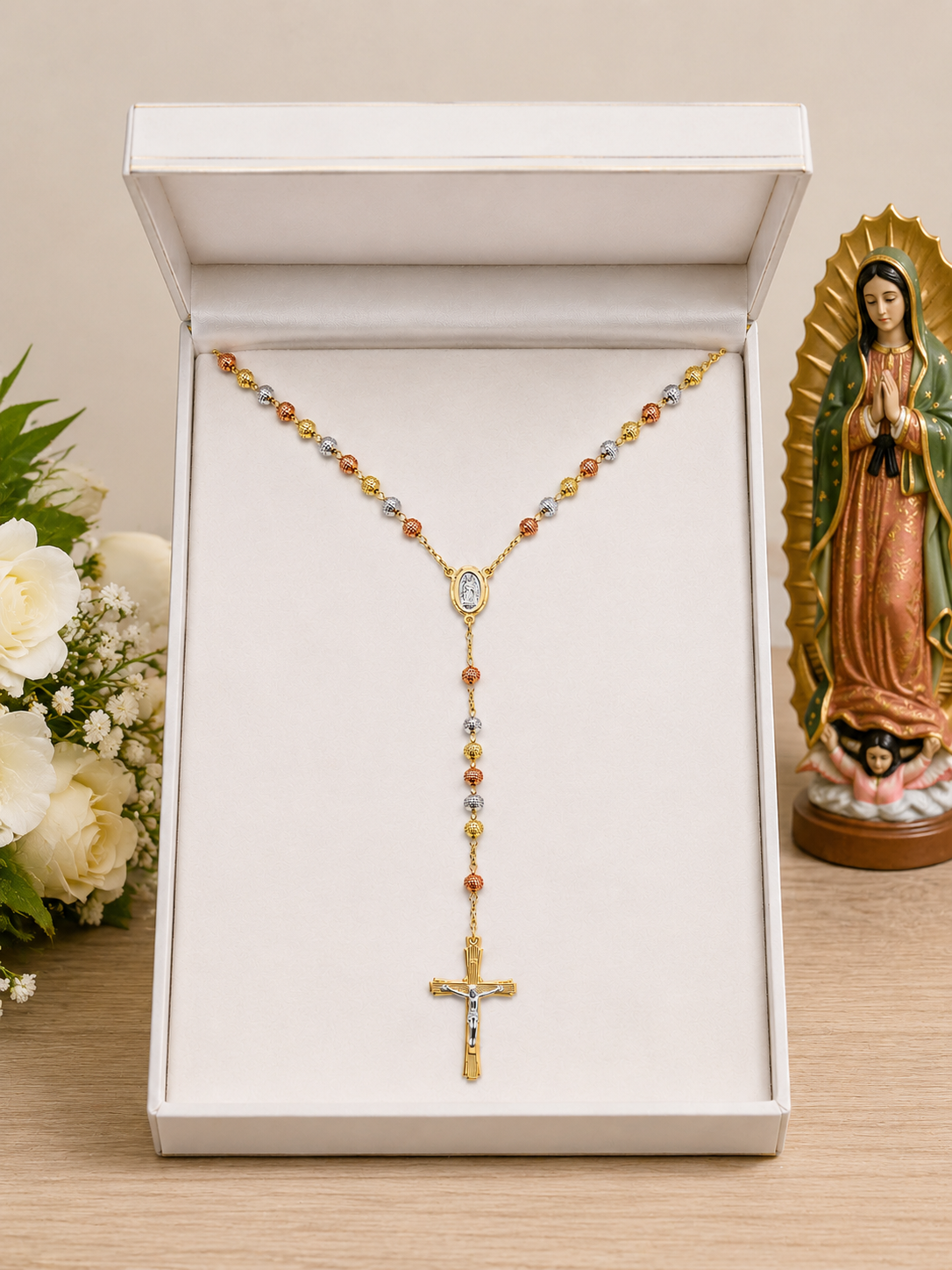 18k tri-color gold plated rosary in white gift box with Our Lady of Guadalupe statue and white roses
