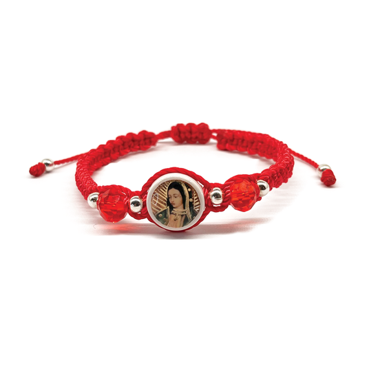 Guadalupe Charm bracelet, woven and made of red nylon, with silver and red beads on white background.