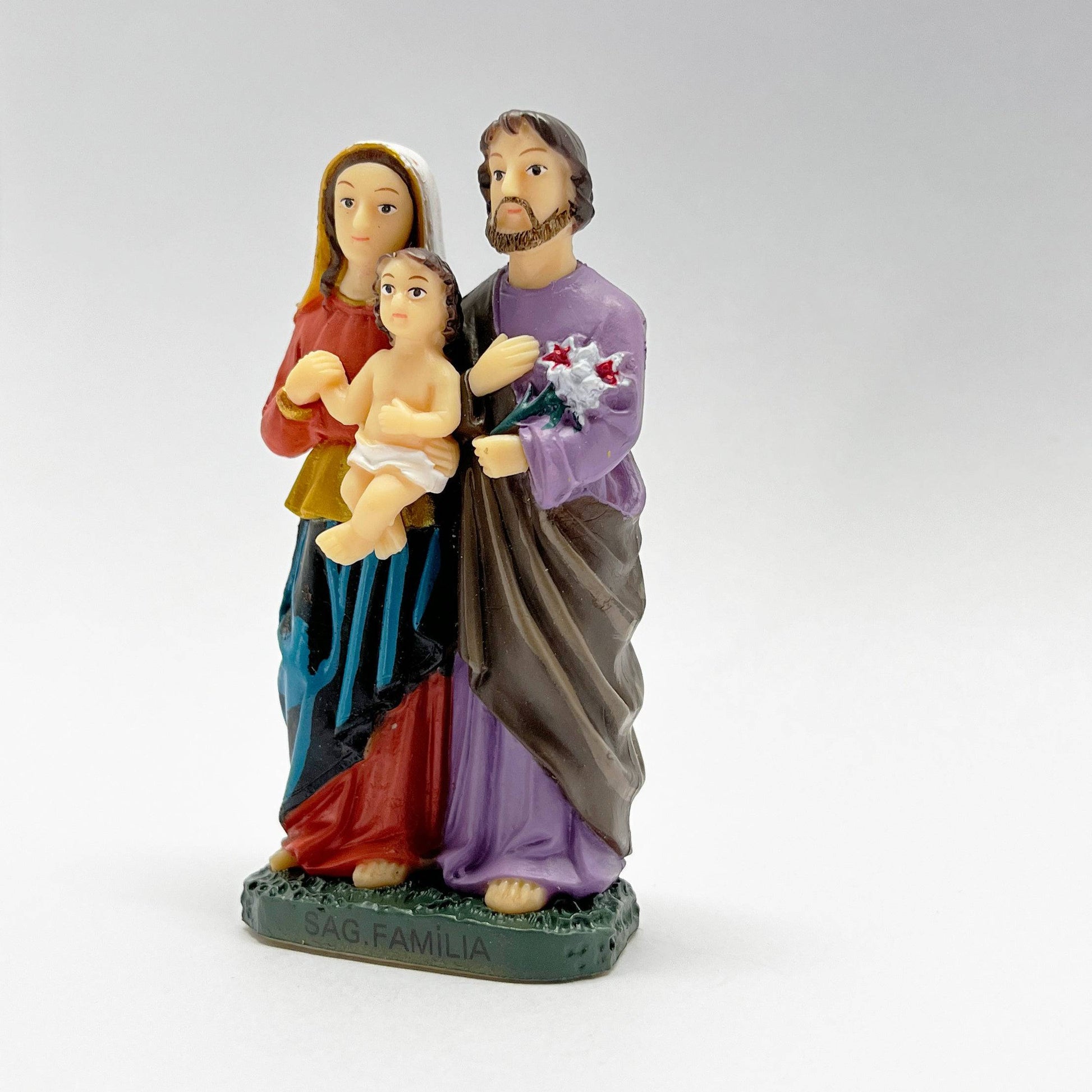 Side view of 3 inch Holy Family Catholic statue showing Mary holding Baby Jesus resin figurine