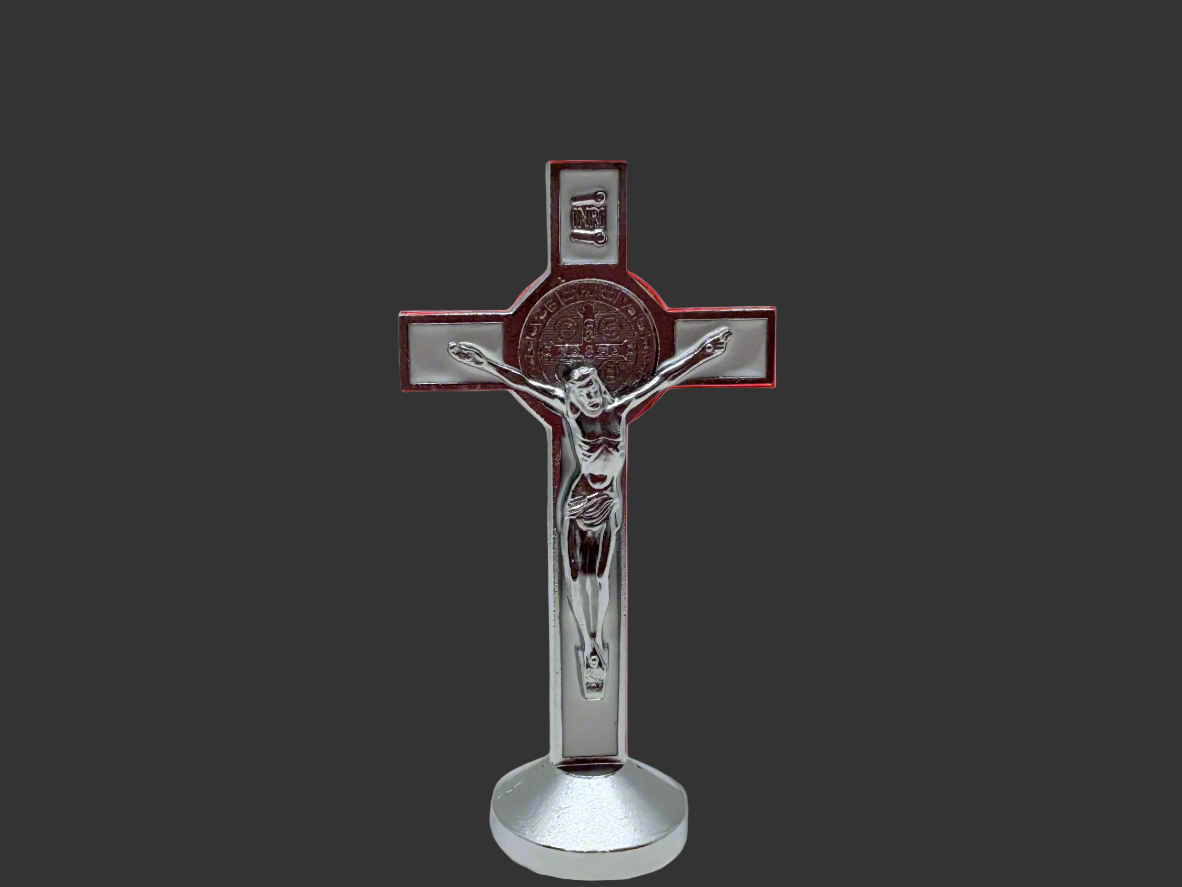 White St. Benedict dashboard crucifix with silver plating and adhesive base, 3-inch Catholic car cross on a dark background. 