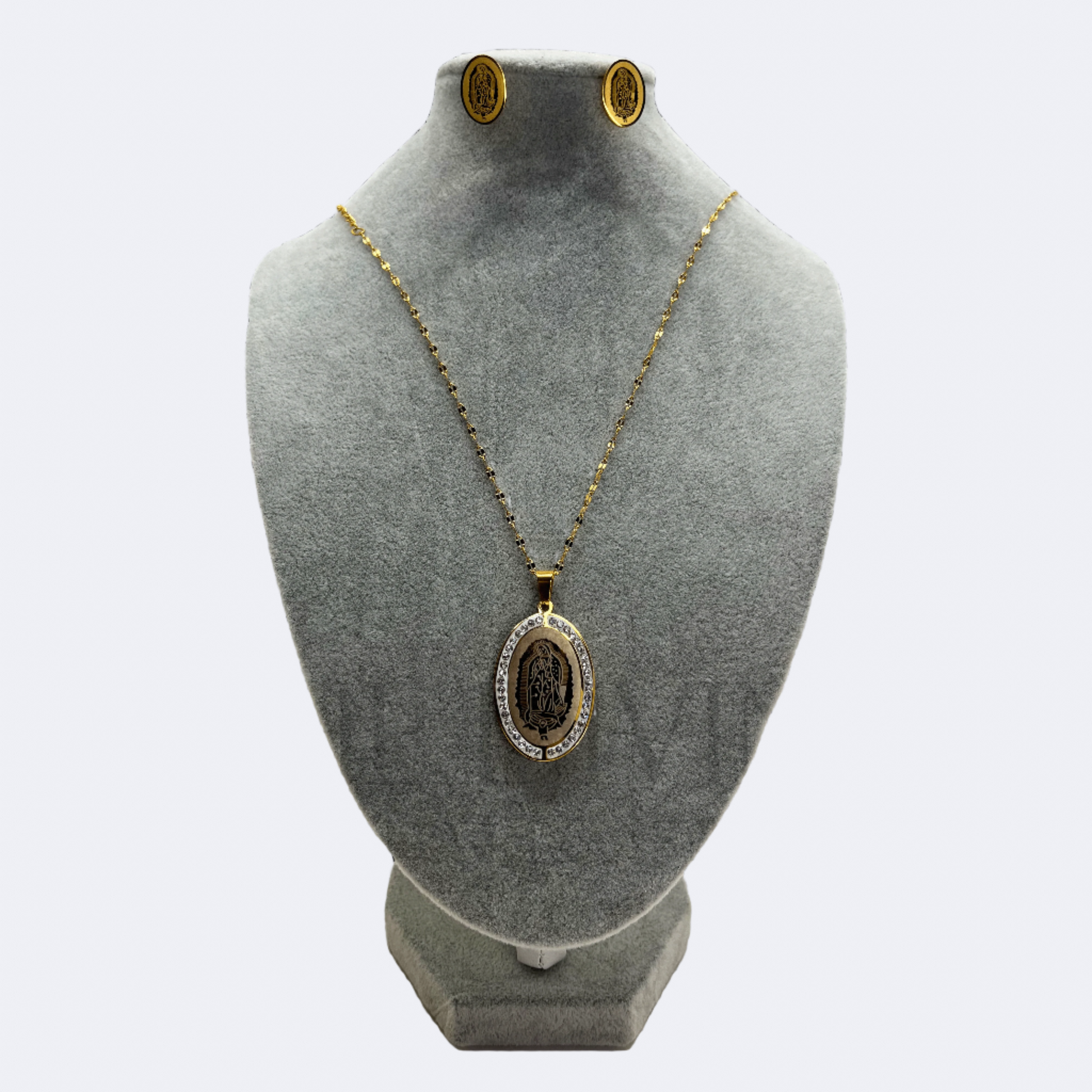 Our Lady of Guadalupe Necklace Set with stainless steel pendant and earrings, featuring a close-up view that highlights the intricate design and details of the Virgin of Guadalupe.