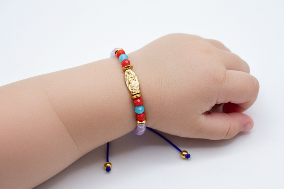 Infant wearing beaded Our Lady of Guadalupe bracelet colorful Catholic baby jewelry on wrist