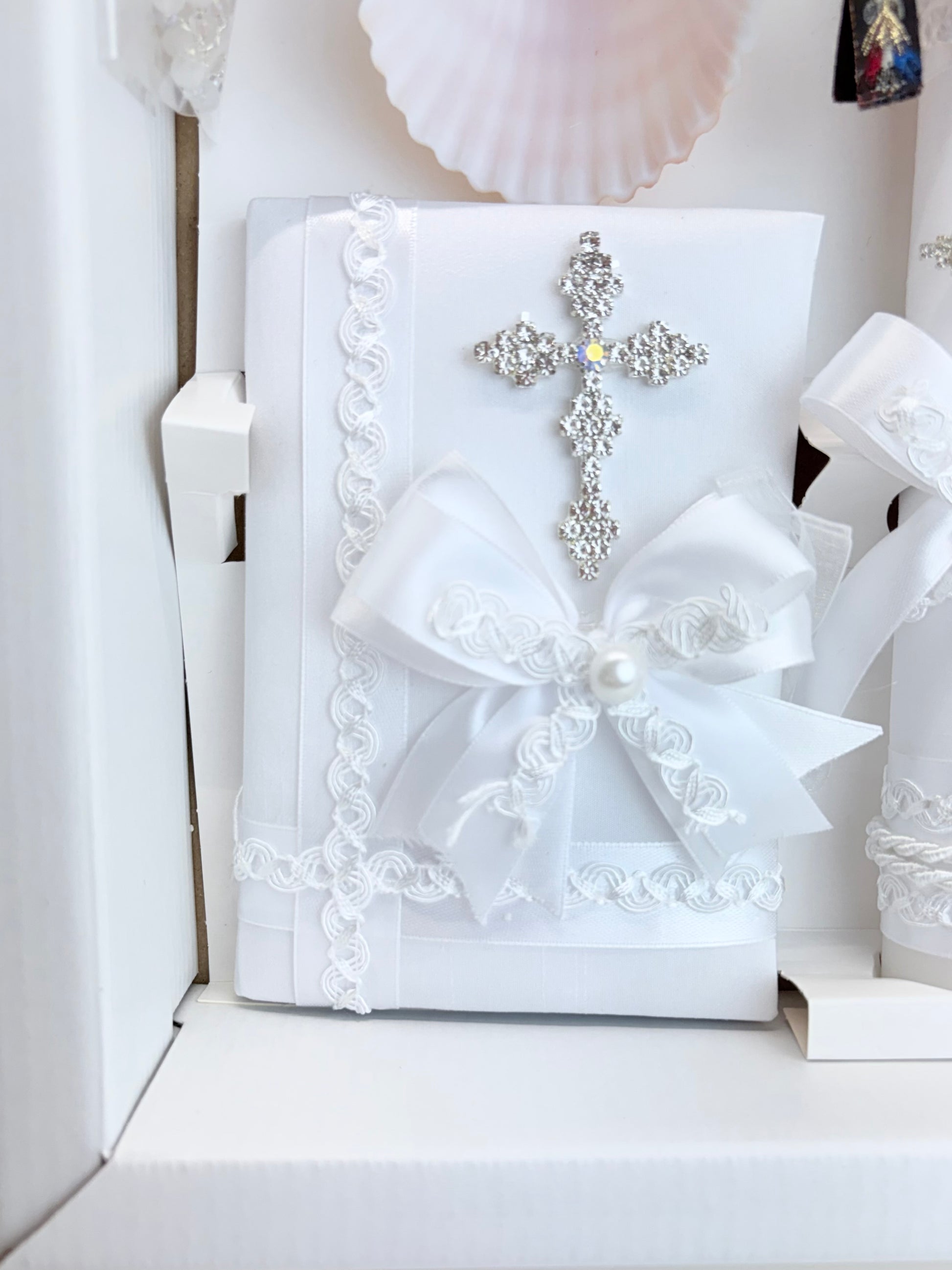 White baptism bible with rhinestone cross brooch aurora borealis crystal center pearl satin bow and white lace trim
