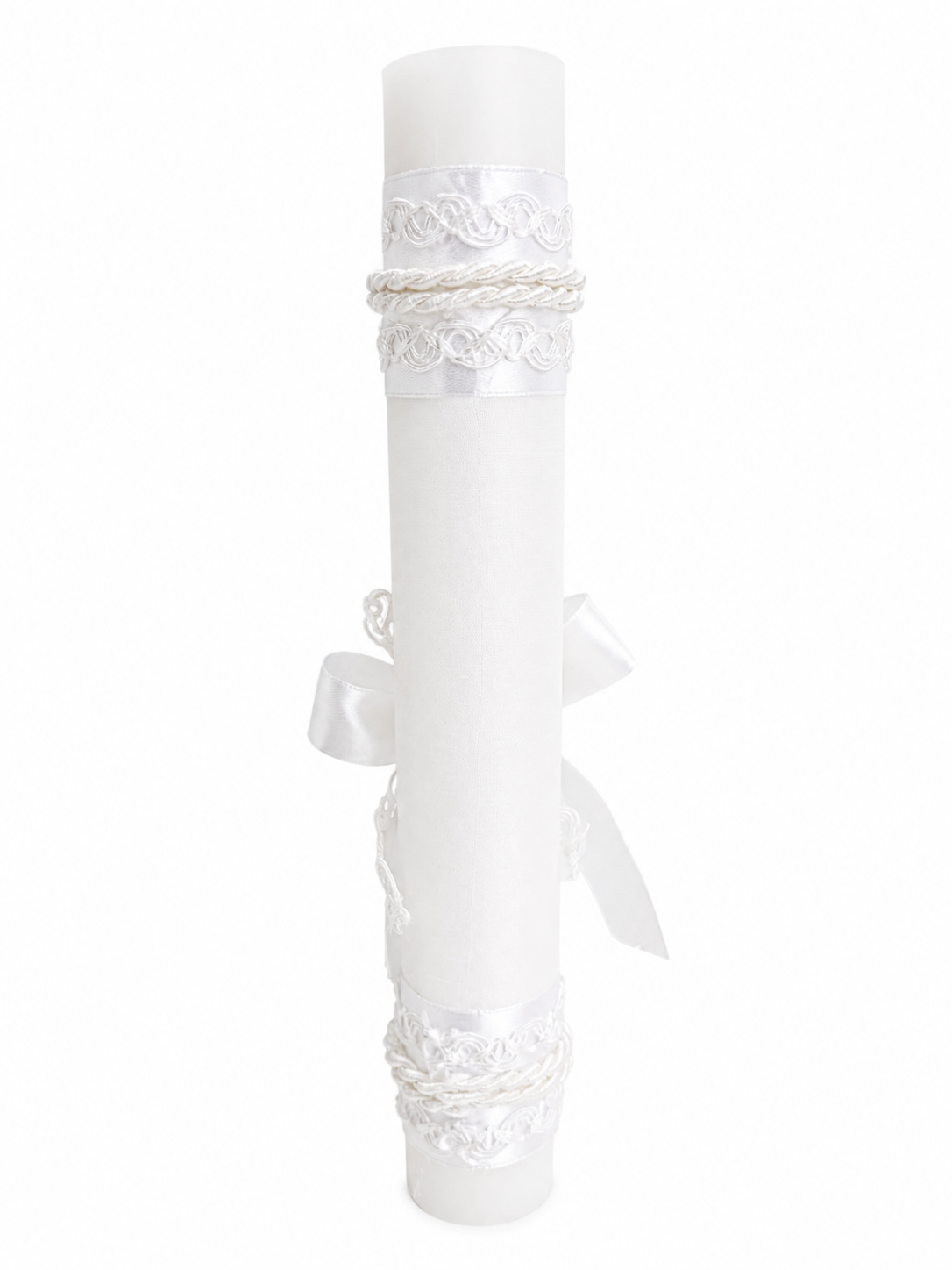 Back view of white baptism candle with rope trim wrap and satin ribbon accent