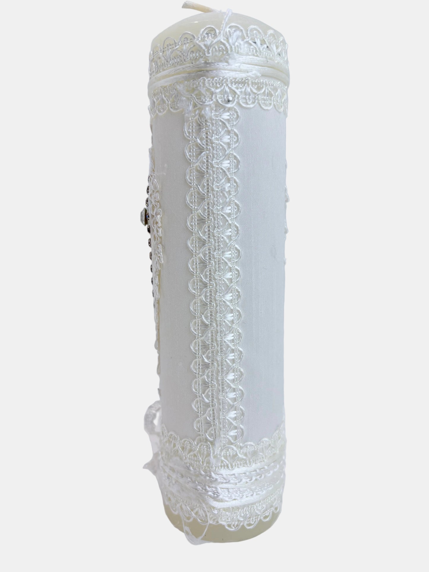 Back view of ivory baptism candle showing full white lace wrap with satin ribbon and delicate lace border