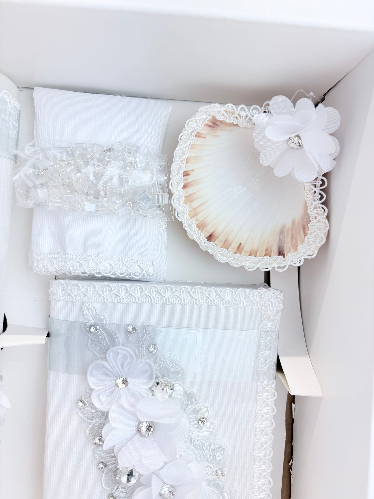 Natural baptism shell with white lace trim chiffon flower accent rhinestone center and clear crystal beaded rosary