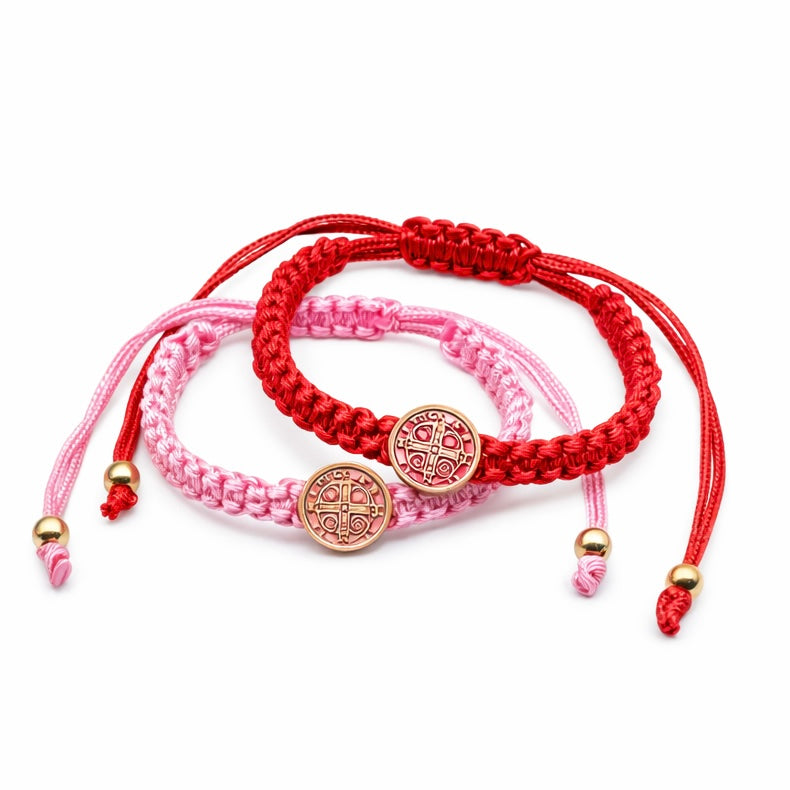 Pink and red St Benedict baby bracelets adjustable Catholic infant jewelry color options comparison