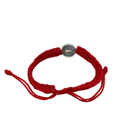 Adjustable red St. Benedict bracelet showing nylon cord and sliding closure back view