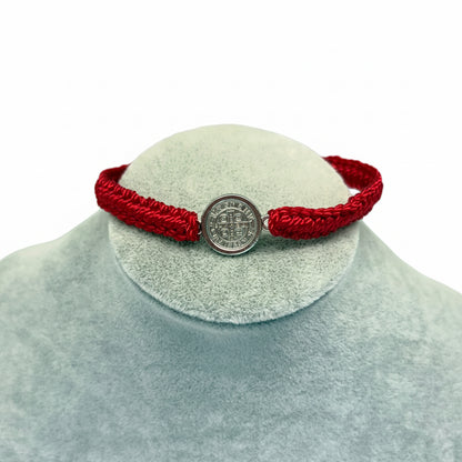 Red St. Benedict bracelet large medal style on display stand, adjustable nylon Catholic bracelet