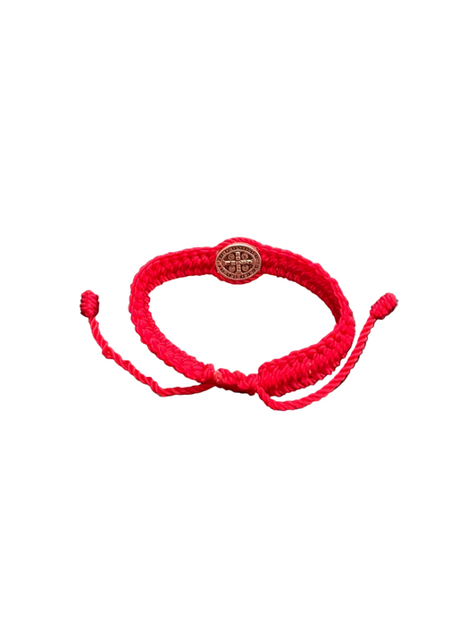 Back view adjustable red braided baby bracelet with St. Benedict medal showing sliding knot closure and cord detail on white background