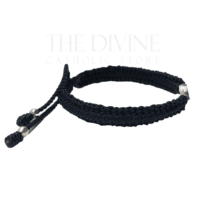 St Benedict black nylon bracelet showing adjustable cord and authentic Catholic medal close up
