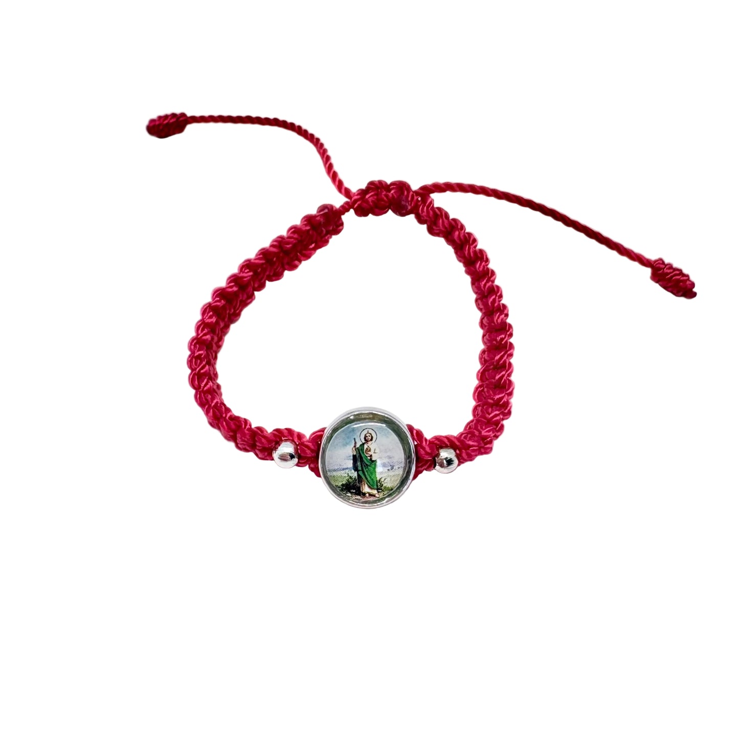 Red adjustable St. Jude bracelet with woven cord and silver saint medal, Catholic protection bracelet on white background