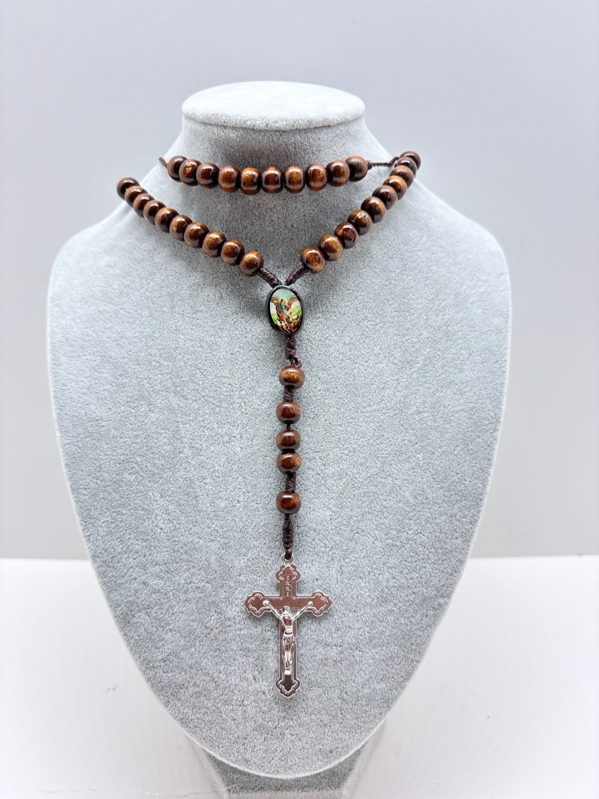Wooden Catholic rosary with Archangel Michael design
