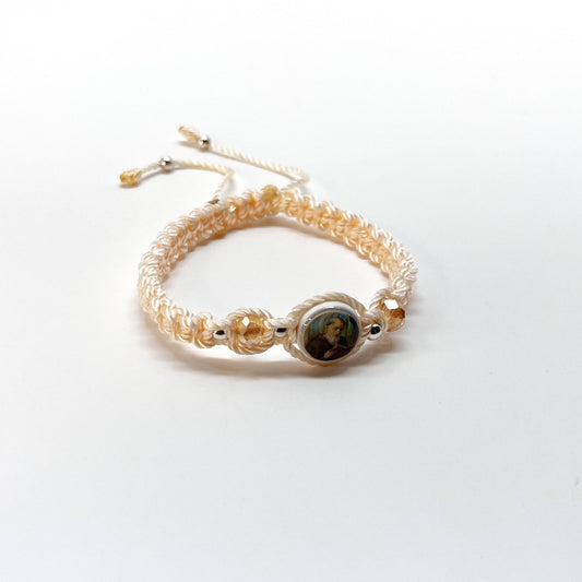 Threaded and woven beige St. Benedict bracelet with St. Benedict charm, beige crystal beads and silver-tone accents for elegant spiritual protection.