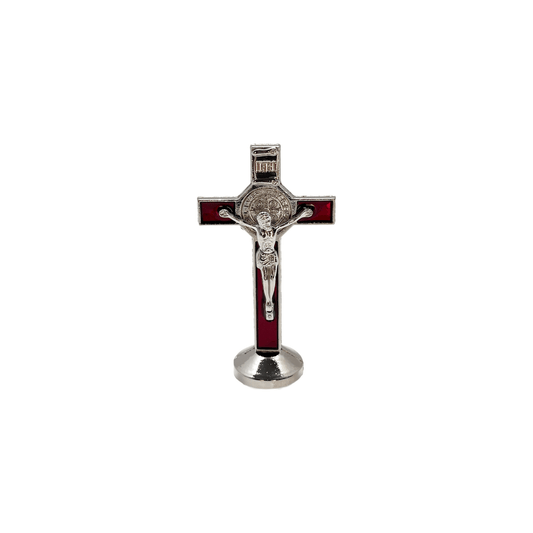 Front view of red St. Benedict car cross 3 inches tall, with adhesive sticker on the bottom, has silver corpus cristi and St. Benedict medal on a white background.