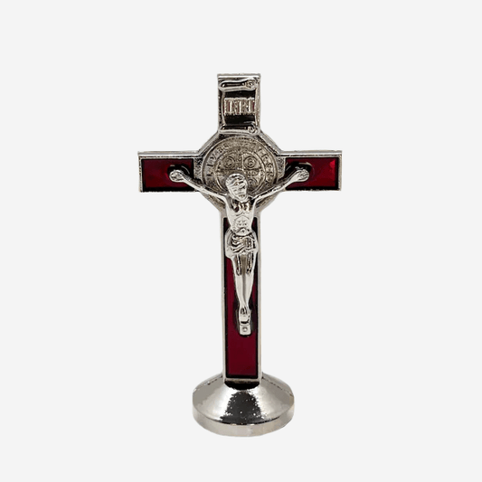 Front view of red St. Benedict car cross 3 inches tall, with adhesive sticker on the bottom, has silver corpus cristi and St. Benedict medal on a white background.