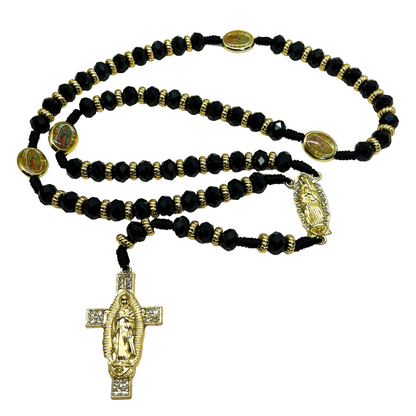 Black beaded Guadalupe rosary with gold crucifix and centerpiece on black nylon cord.