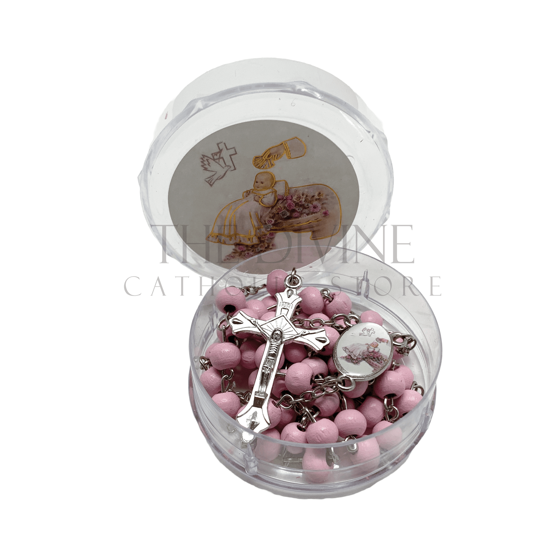Pink baby girl baptism rosary with crucifix in round clear case featuring a baptism-themed illustration on the lid.