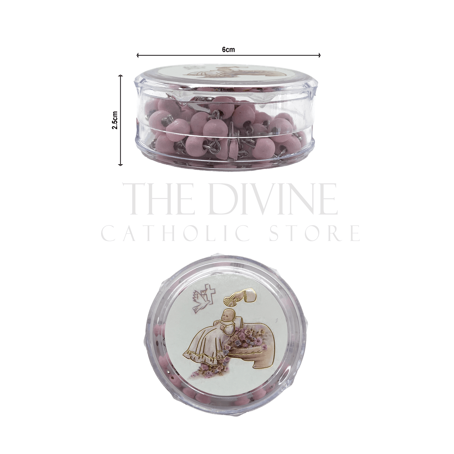 Pink baby girl baptism rosary with crucifix in round clear case featuring a baptism-themed illustration on the lid and showing dimensions of round container, 6cm x2.5 cm on white background.