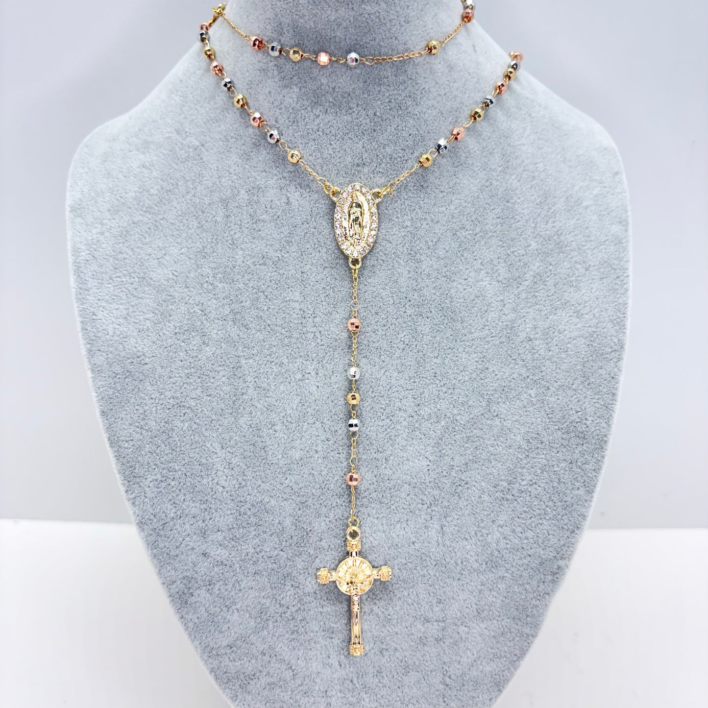 Tri-color Guadalupe rosary necklace with textured beads and CZ centerpiece on gray display stand 17 inch Catholic jewelry